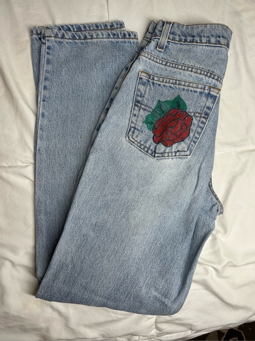 Light Wash Levi’s Jeans with Red Rose Embellishment